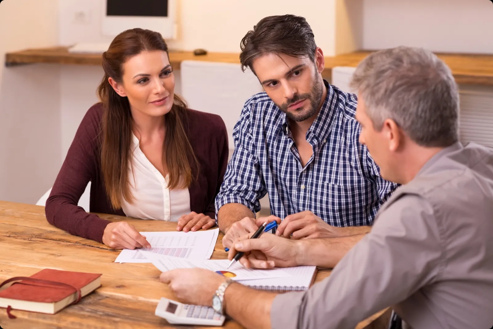 Image of couple meeting with banker